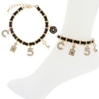 FASHIONISTA NUMBER FIVE LEATHER WOVEN ENAMEL COATED MULTI CHARM ADJUSTABLE CHAIN LINK ANKLET