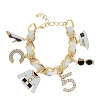 FASHIONISTA NUMBER FIVE LEATHER WOVEN ENAMEL COATED MULTI CHARM ADJUSTABLE CHAIN LINK BRACELET