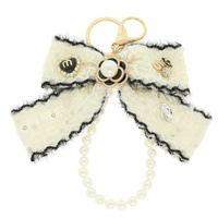 TWEED BOW PEARL BAG CHARM WRISTLET