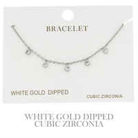 CUBIC ZIRCONIA DISC ADJUSTABLE CHARM BRACELET IN YELLOW GOLD AND WHITE GOLD PLATING