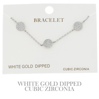 CUBIC ZIRCONIA PAVE DISC ADJUSTABLE BRACELET IN YELLOW GOLD AND WHITE GOLD PLATING