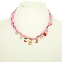 FABRIC NECKLACE WITH PLAYFUL ACCENTS